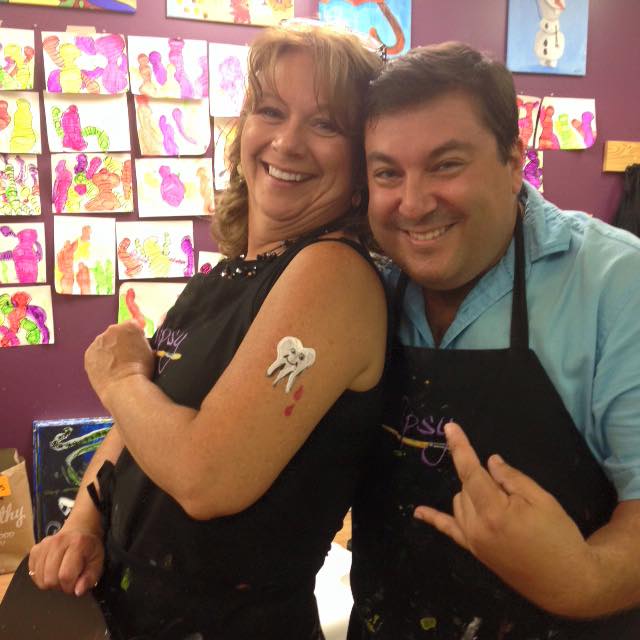 Dr. Woodman being silly with Jennie at our office painting party. What a cool ta…